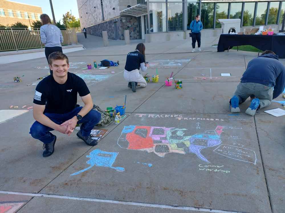Psychology major Connor Wardrop presents at GVSU Chalk Art Symposium Spotlight